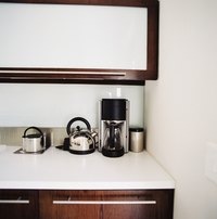 Spruce up laminate cabinets with a coat of paint.