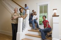 A family is sitting in their new home.