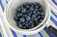 Leave some room in the strainer or colander to swirl the blueberries.