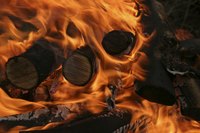 Wood contains flavor compounds that transferr to food through smoke.