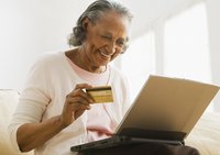 Woman shopping online with credit card.