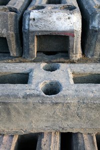 Cinder blocks can be cut with a Skilsaw.