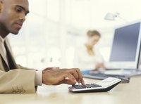 Businessman using a calculator.