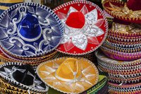 Make a colorful paper sombrero to keep the sun off your face.