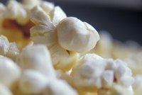 Season popcorn as soon as it pops so the starch absorbs more flavor.