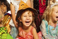 Close up of children dressed in Halloween costumes.