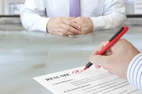 Employer marking up candidate's resume with positive notes