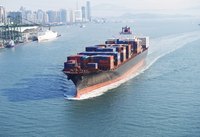 Large shipping container arriving in port.