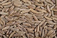A close-up of cumin seeds.