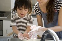 A family is washing their hands.