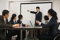 Man running business meeting in office.
