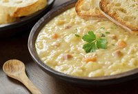 Bowl of split pea soup with side of toasted bread