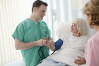 Doctor with senior in hospital