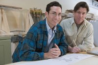 Two men in a woodworking shop.