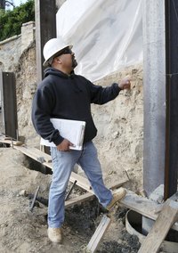 Construction worker inspecting work site