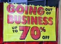 Close-up a sign that reads "going out of business"