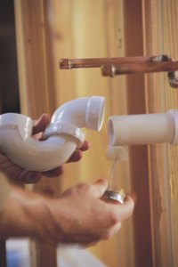 In mant cases you can move plumbing connections to create space under sinks.