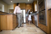 Kitchen cabinets can frame your refrigerator for a neat, finished decor.