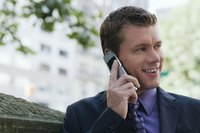 A man is making a call on a cell phone.
