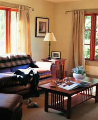 Whether brass or plastic, curtain rods have little to do with the maximum allowable weight of curtains.