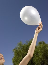 Use white balloons to create a wall full of underwater bubbles.