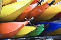 Bright colored kayaks stacked on each other