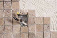 Safety is key when grouting around an electrical outlet.