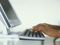 Woman typing on a computer keyboard