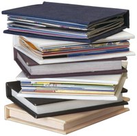 Place books on a floating shelf to decrease the clutter on tabletops.
