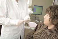 A younger boy is at the doctors office.