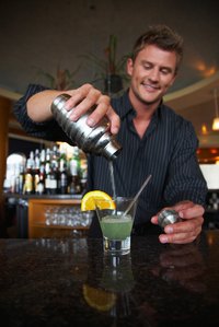 A bar provides a convenient location to prepare drinks.