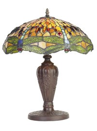 Tiffany lamps display Victorian motifs like elaborate floral designs and dragonflies.