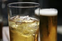 Close-up of iced cider in tall glass