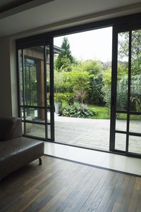 The track of a sliding door will accumulate dirt and debris, which can make it squeak.