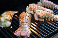 Butterfly lobster tails so the smokiness from the grill penetrates the meat.