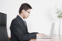 Businessman typing on a laptop