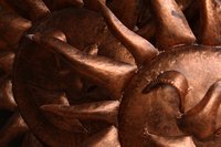 Embossing creates custom designs in copper metal.