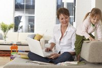 A woman is on her laptop.