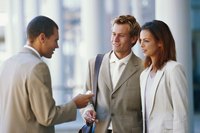 Professionals exchanging business cards.