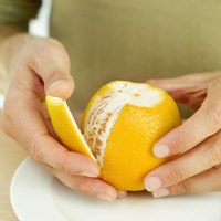Woman peeling an orange.