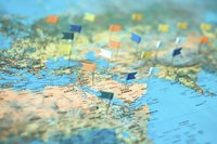 World map filled with pins