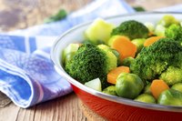 An assortment of steamed vegetables in a bowl.