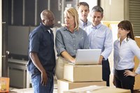Image of business workers in a warehouse.