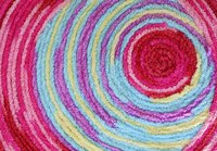 Recycle used clothes and sheets for your rug.