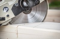 Table saw cutting through lumber.