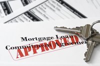 An approved mortgage loan application with keys to a house.