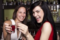 Image of women holding drinks.