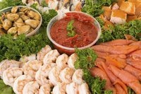 A nicely arranged shrimp and seafood platter.