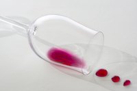 Act fast: Blot red wine spills from a vinyl tablecloth and launder it in cold water.