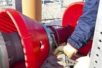 A workman prepares tools for a mandrel inspection